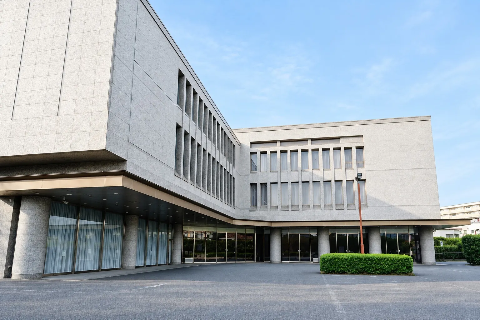 落合斎場の外観。石張りの3階建ての建物（イメージ）